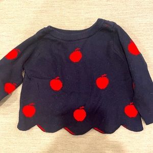 Navy blue Jacadi sweater with apple detail.